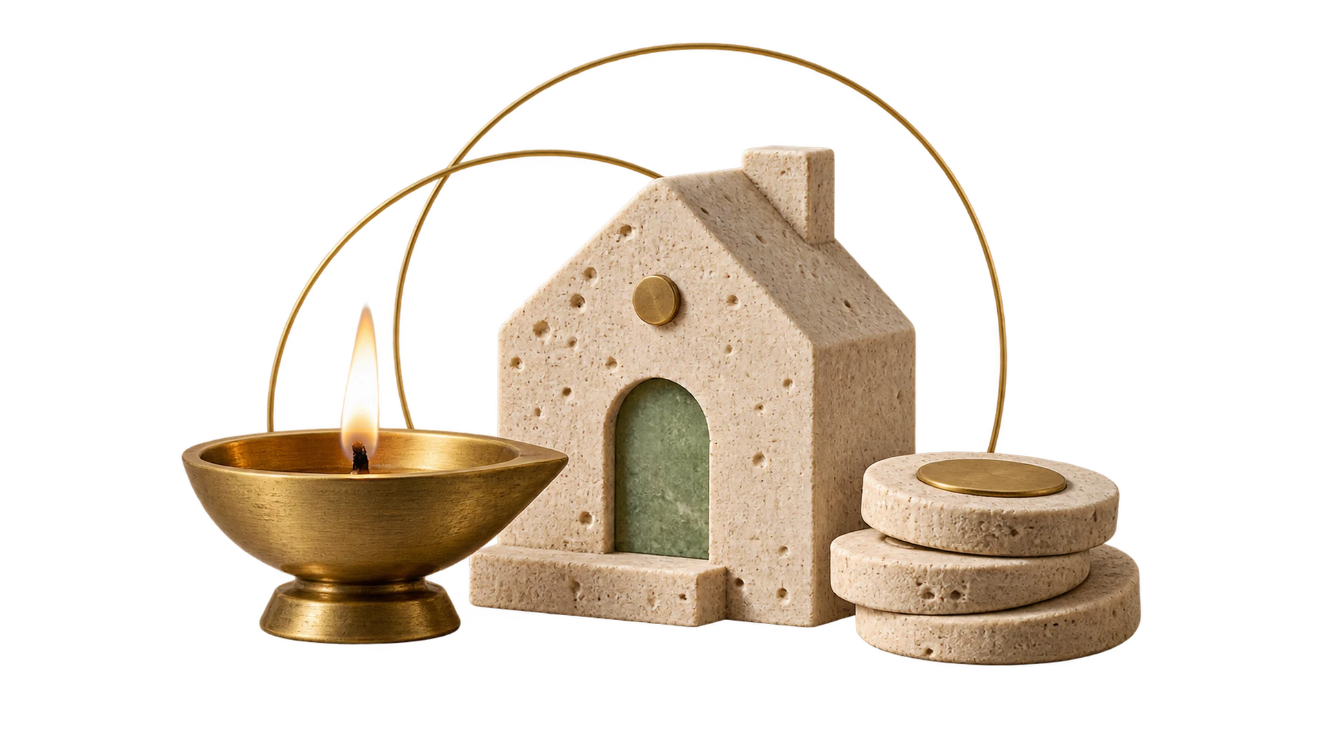 A brass diya lamp glowing beside a travertine house and a small stack of stone coins
